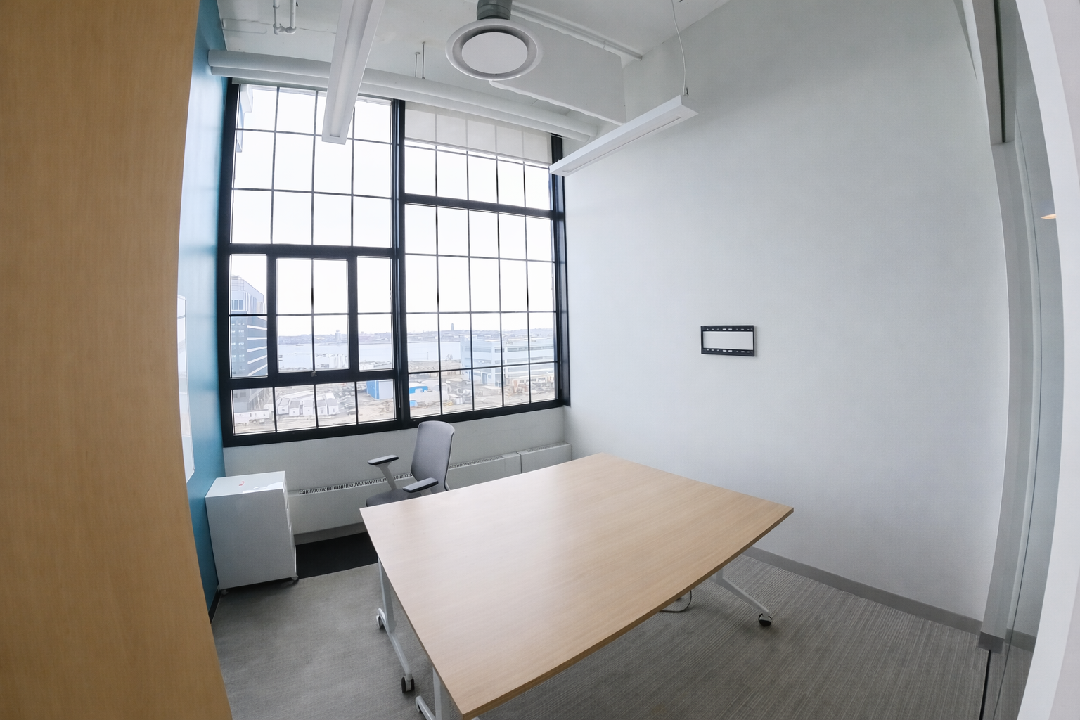 Modern Co-Working Office with Natural Light and Seaport Views