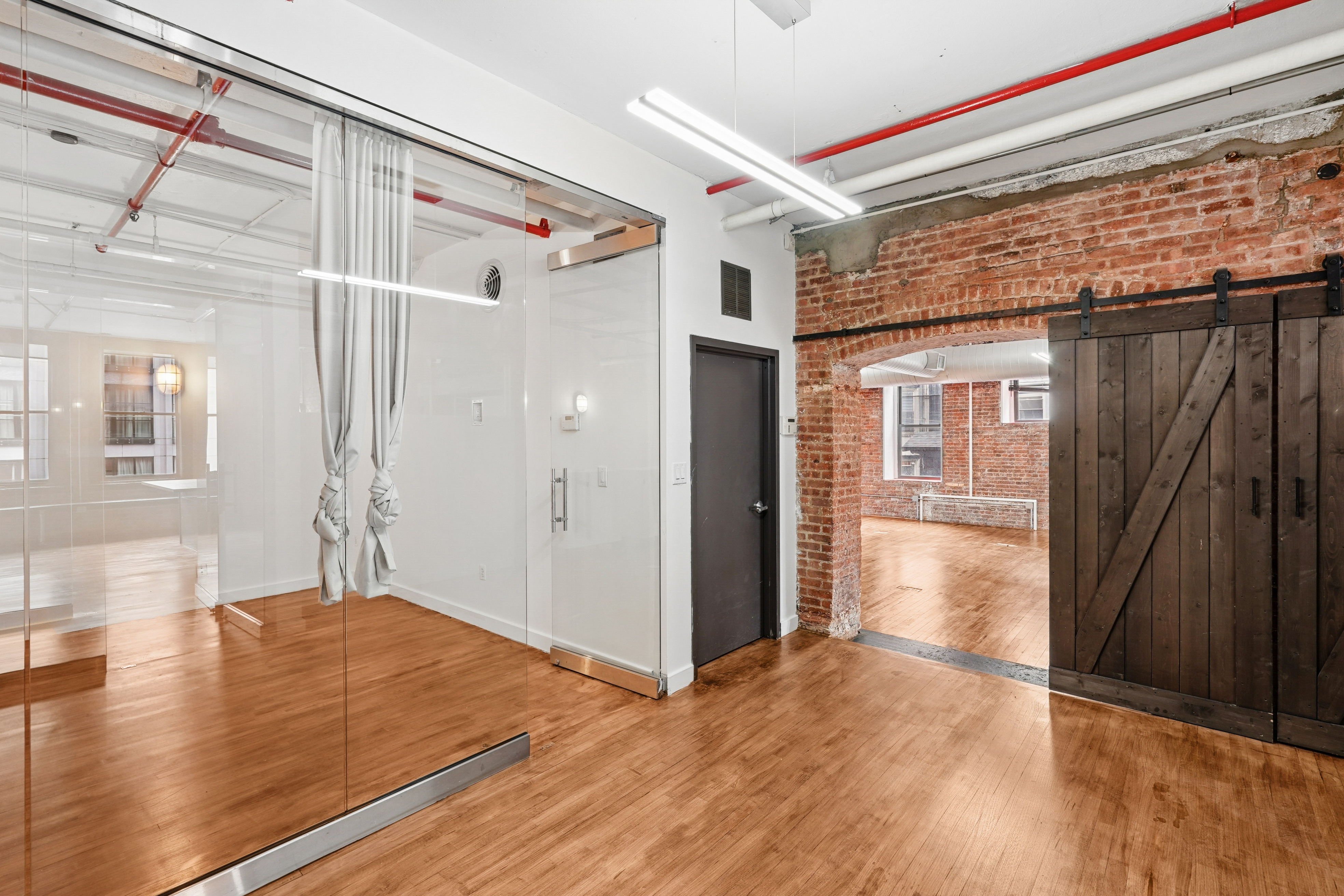 Chic SoHo Office with Exposed Brick and Natural Light