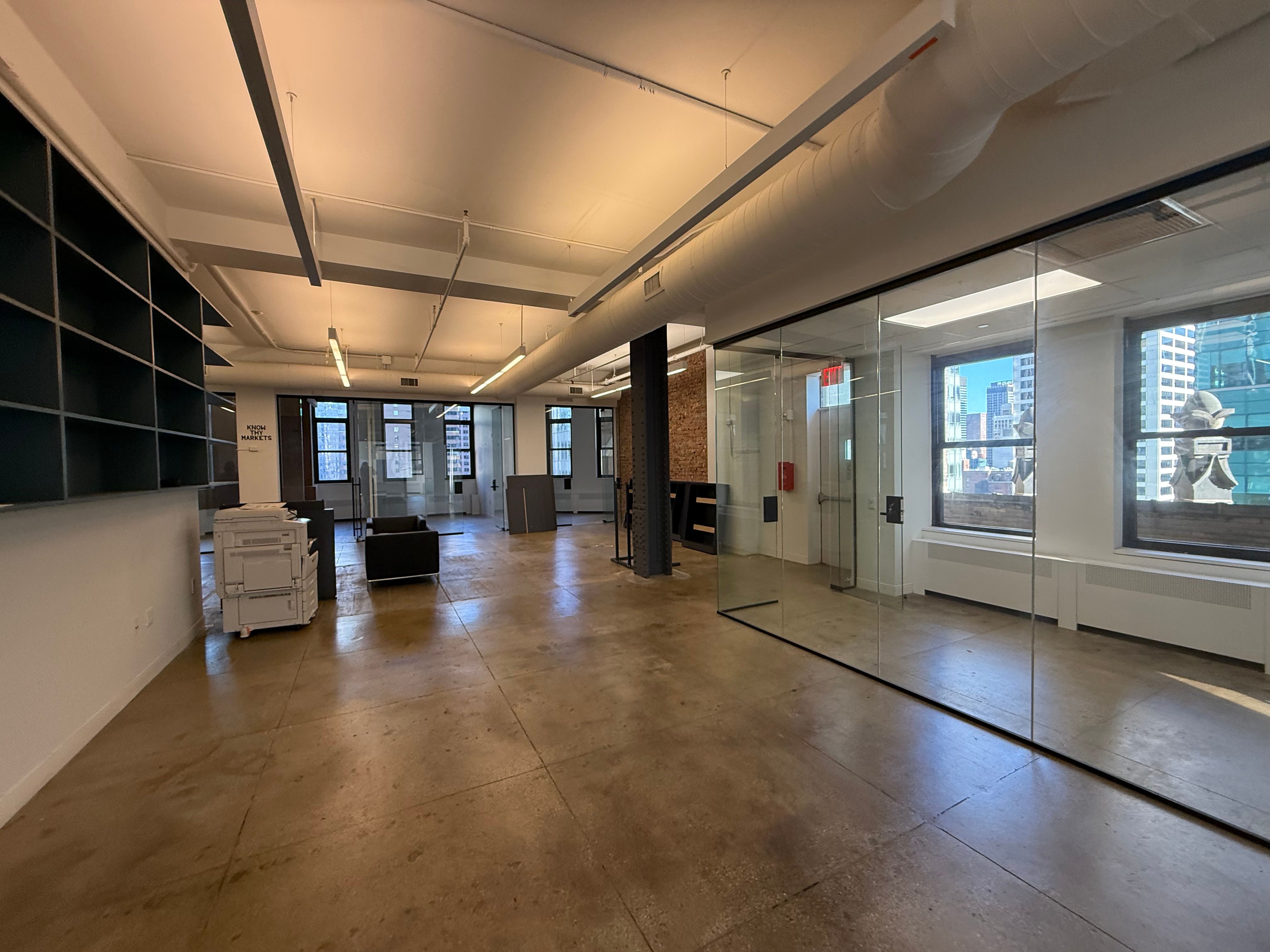 Dynamic Midtown Studio Office Blending Industrial Texture & Sleek Design