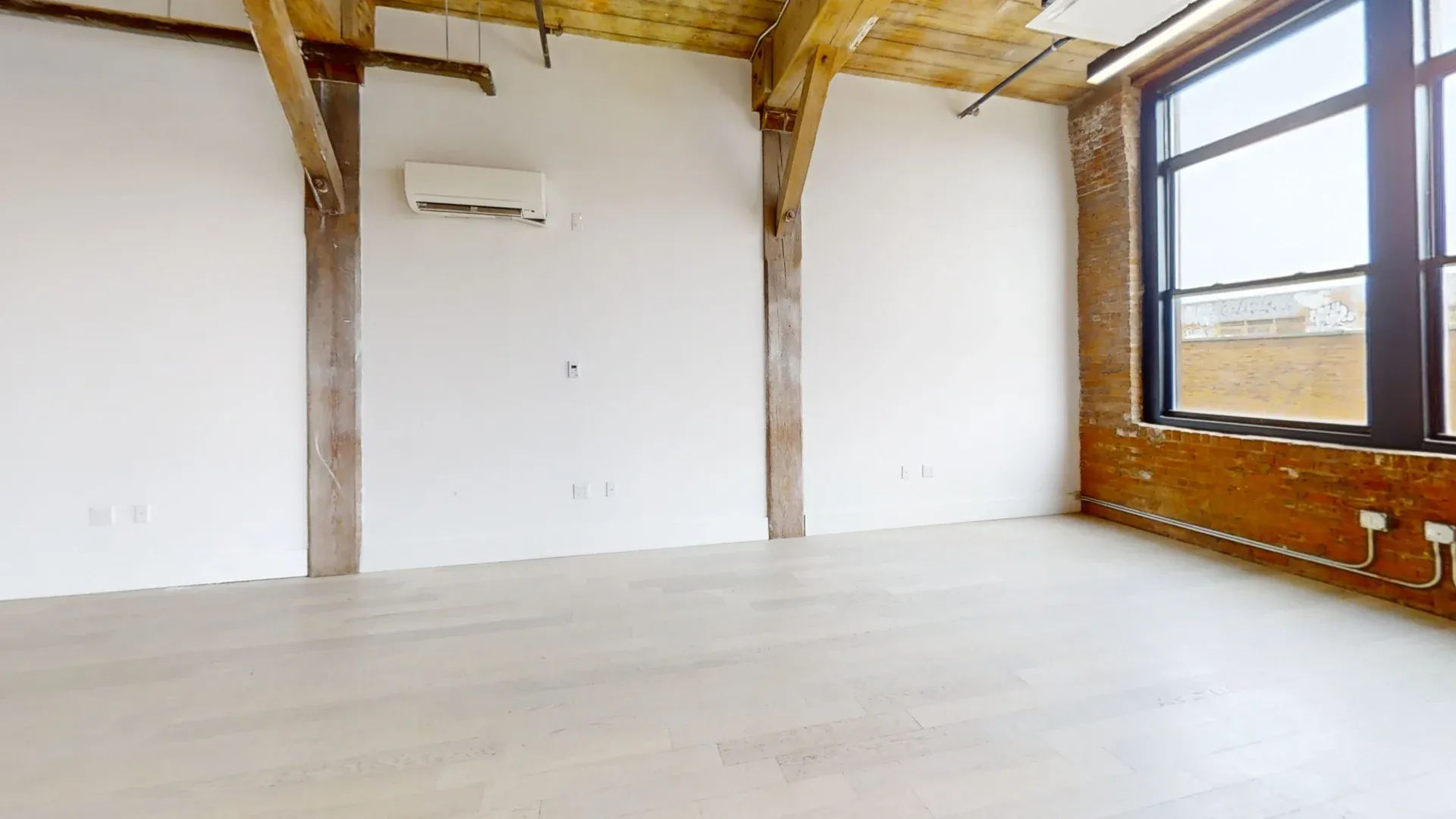 Airy Brooklyn Office with Exposed Brick and High Ceilings