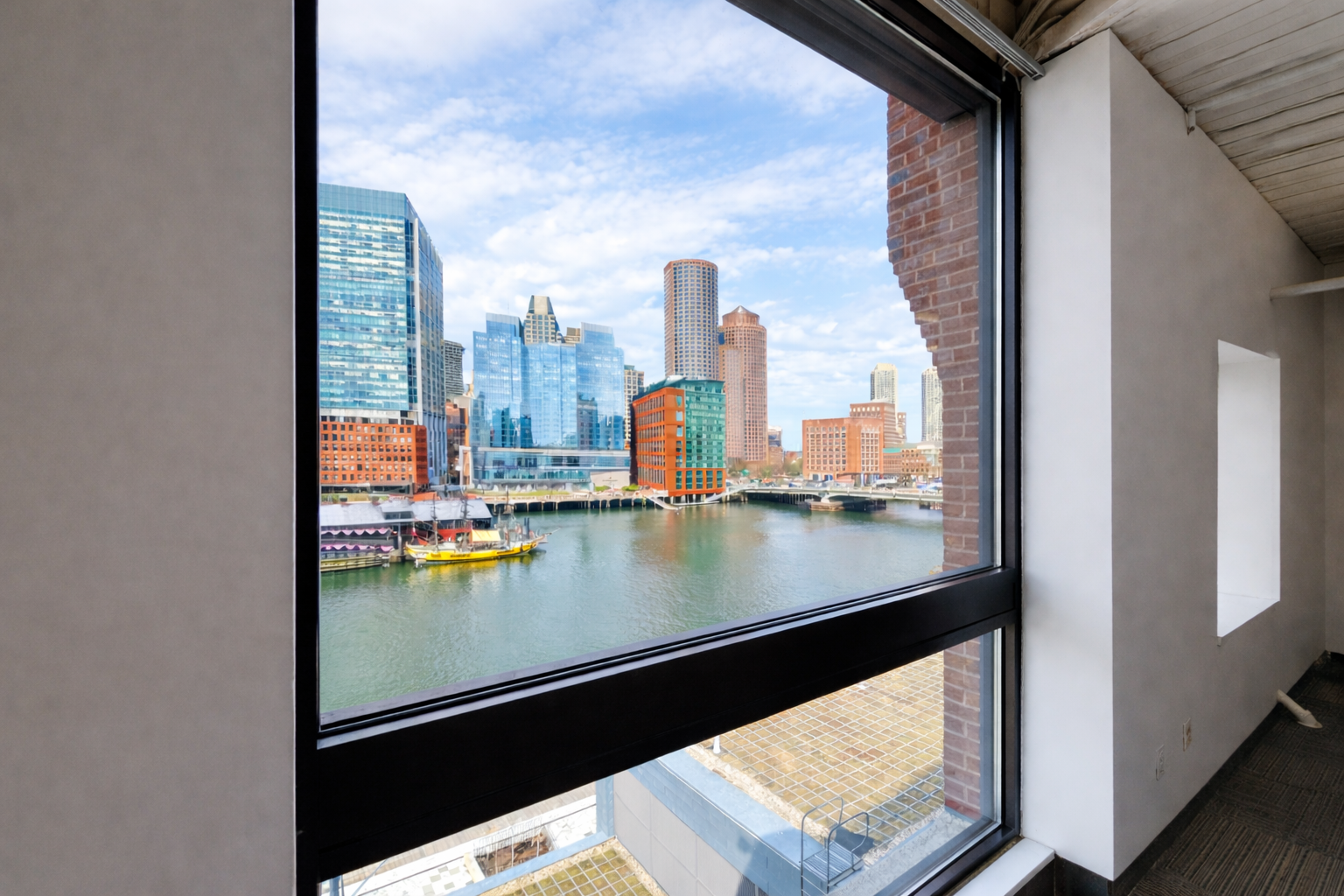 Vibrant Seaport Office with Exposed Brick and Light