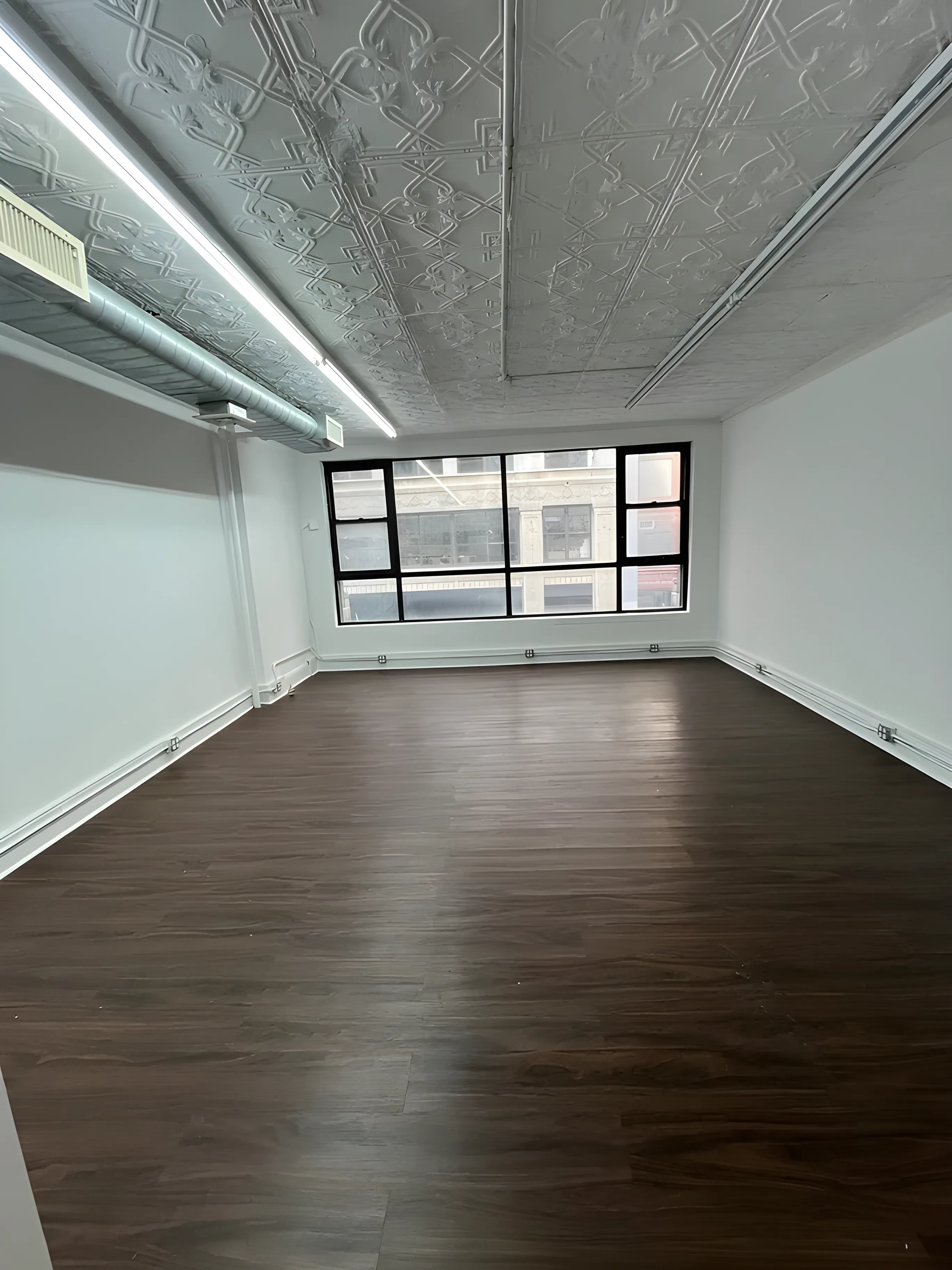 Airy Midtown Office with High Ceilings and Light