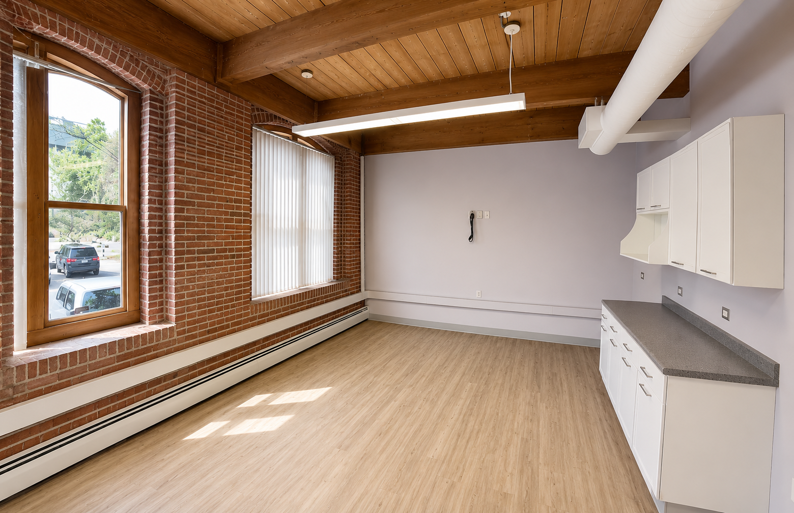 Light-Filled Office with Exposed Brick in East Cambridge