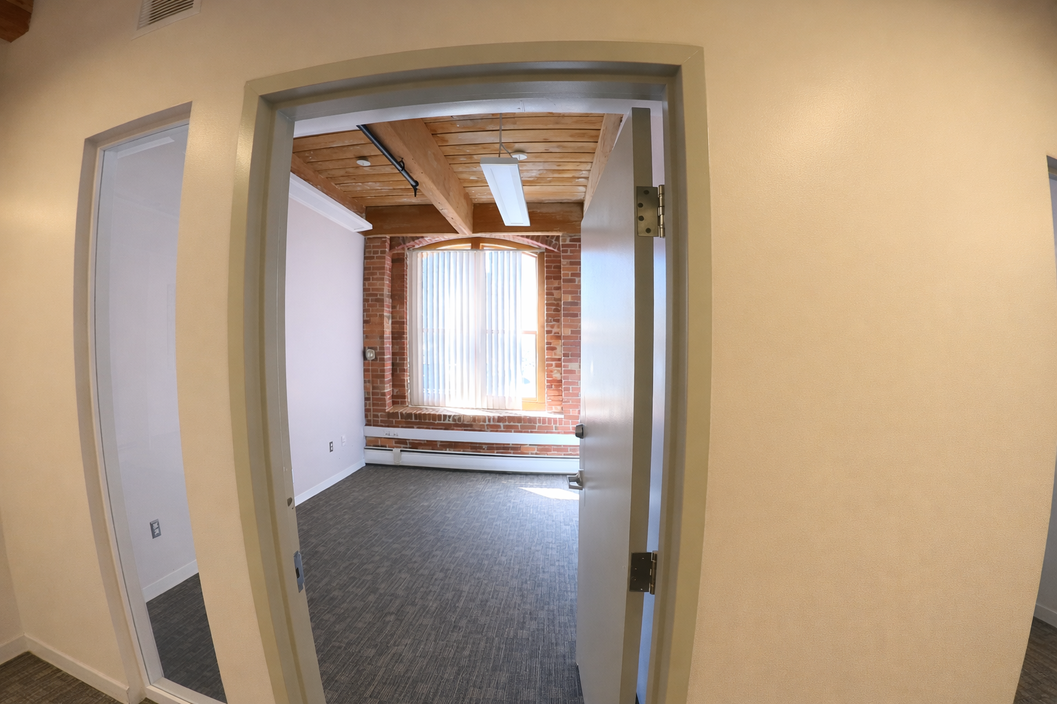 Light-Filled Office with Exposed Brick in East Cambridge