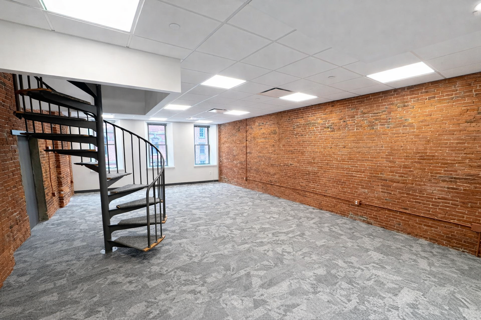 Creative Downtown Office with High Ceilings and Brick Walls