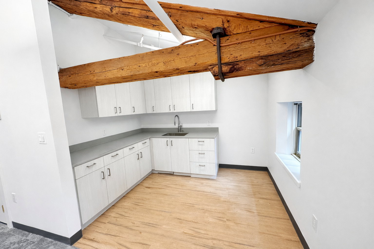 Creative Downtown Office with High Ceilings and Brick Walls