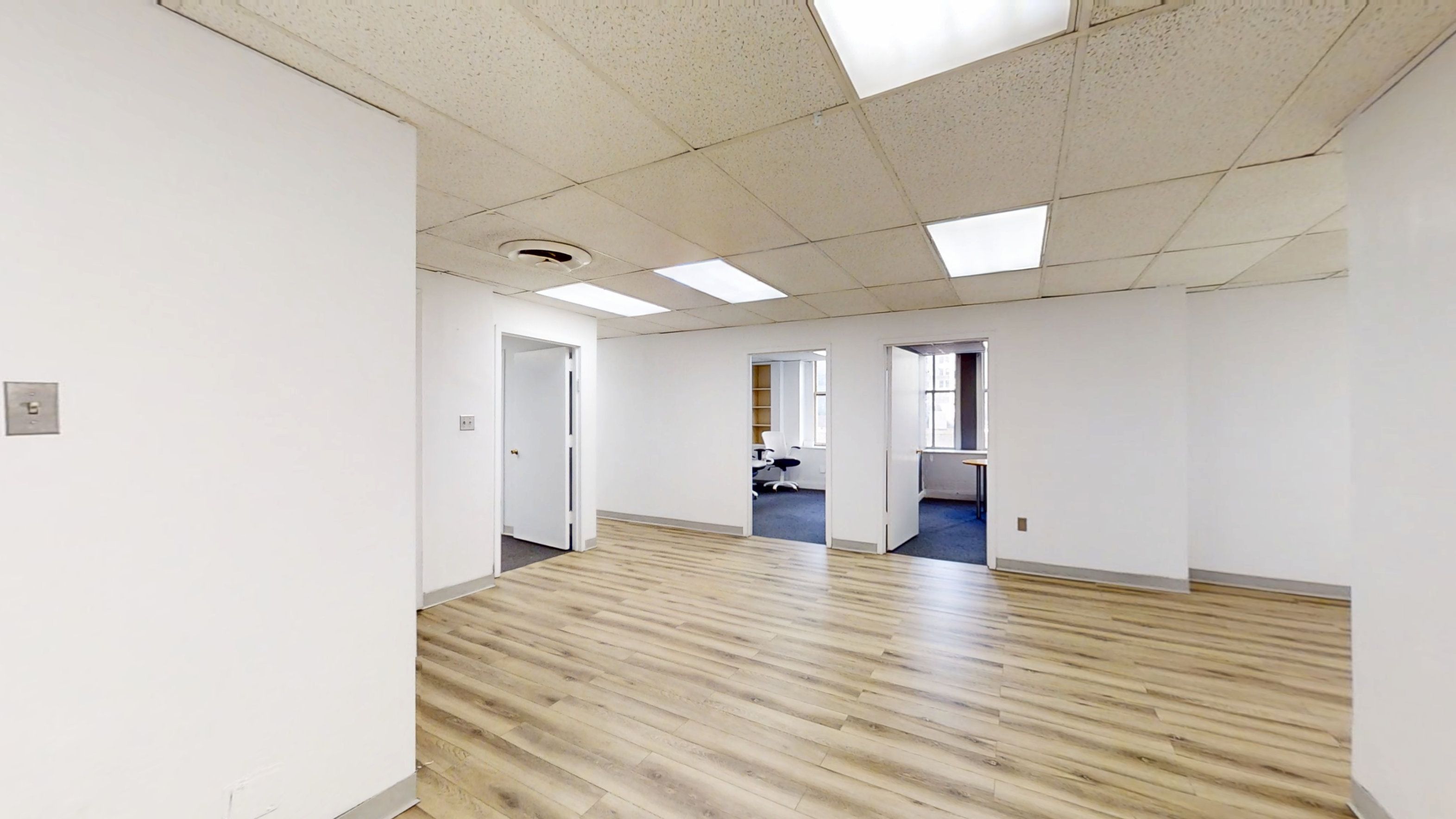 Spacious Office with Natural Light and Private Offices